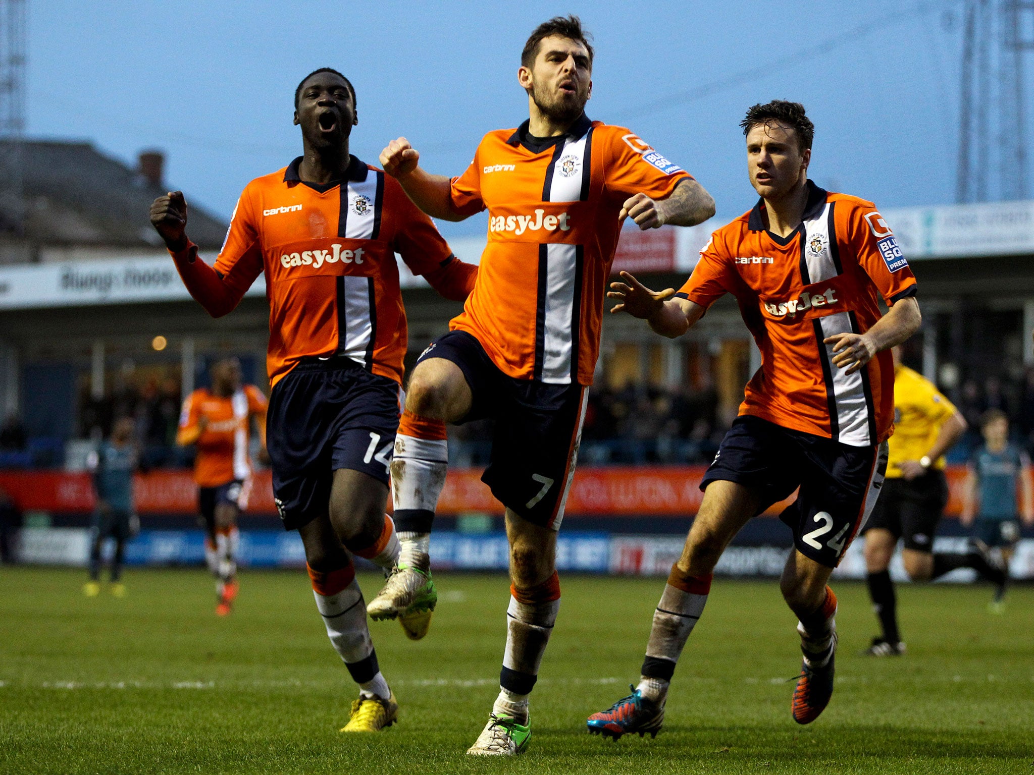 Alex Lawless of Luton celebrates after scoring the opening goal