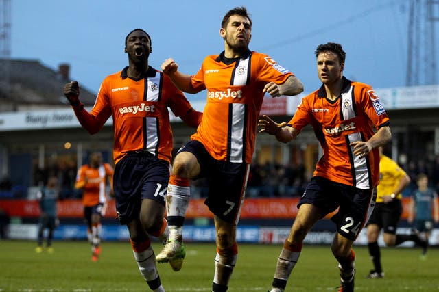 Alex Lawless of Luton celebrates after scoring the opening goal