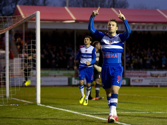 Reading's English striker Adam Le Fondre celebrates scoring a penalty