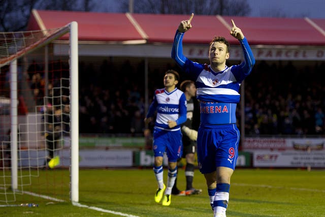 Reading's English striker Adam Le Fondre celebrates scoring a penalty