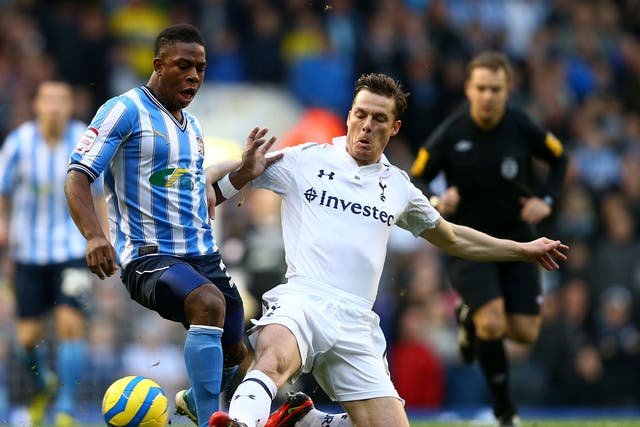 Franck Moussa of Coventry City is challenged by Scott Parker of Tottenham Hotspur