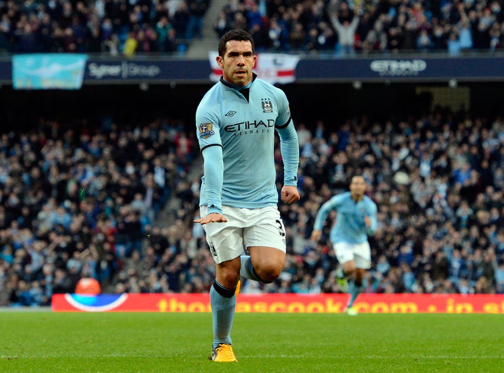 Manchester City's Argentinian striker Carlos Tevez celebrates scoring from a free kick