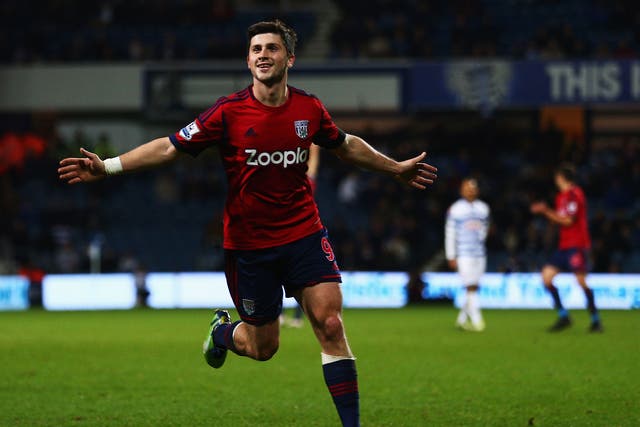 Shane Long of West Bromwich Albion celebrates scoring the first goal