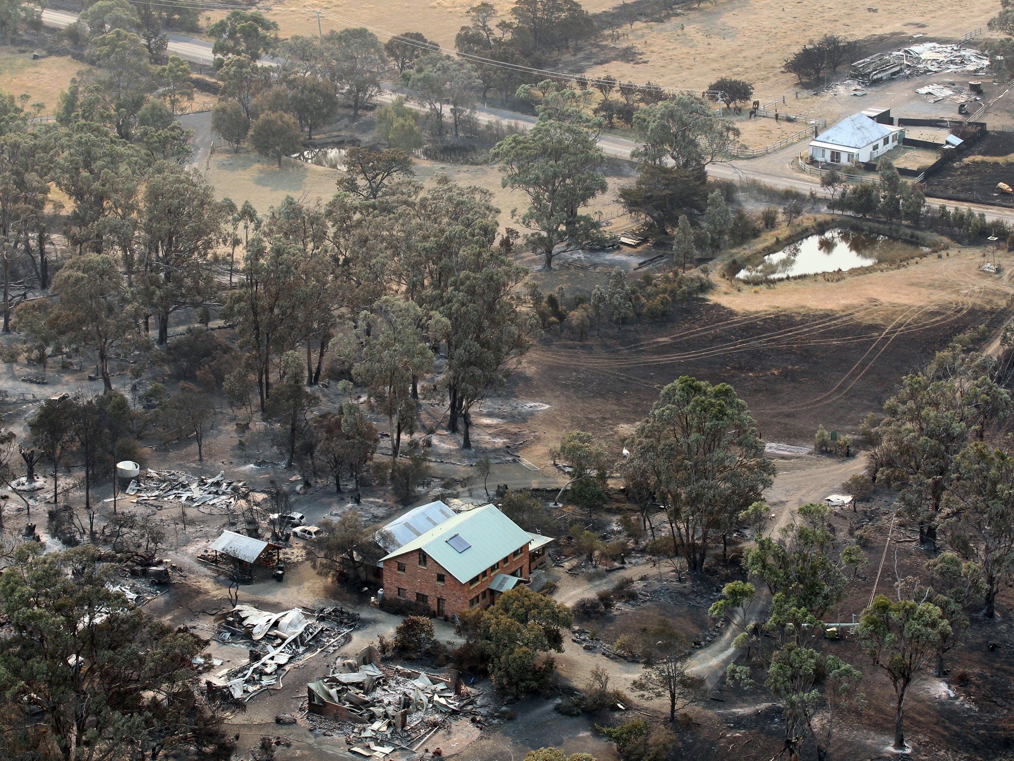 Burnt out: Fires razed houses in Dunalley, forcing residents to flee