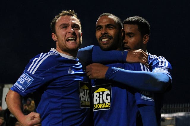 Matthew Barnes-Homer (C) of Macclesfield Town is congratulated by team-mates
