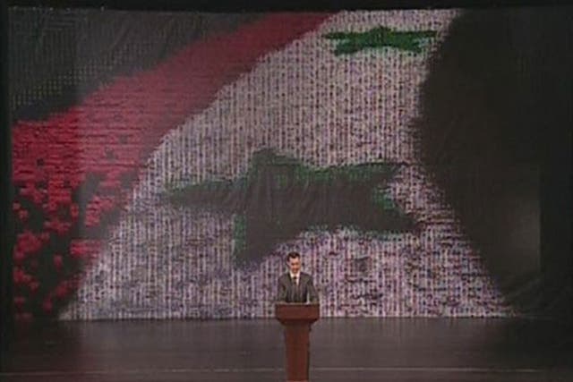Syria's President Bashar al-Assad speaks at the Opera House in Damascus in this still image taken from video 
