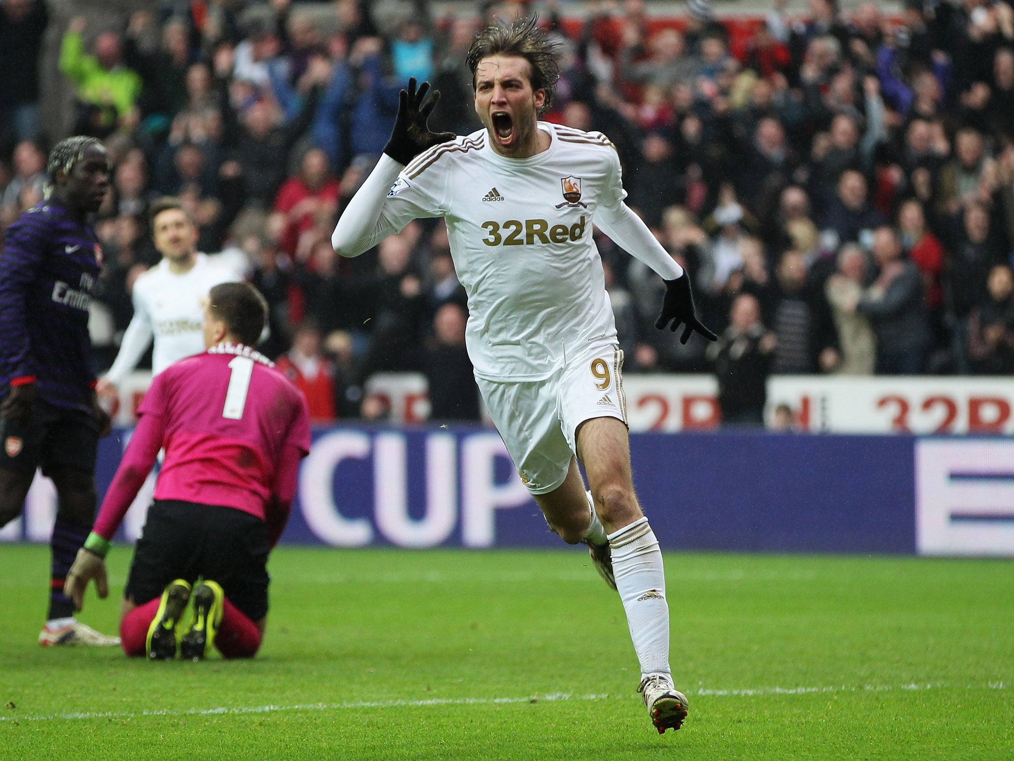 Miguel Michu of Swansea City celebrates as he scores their first goal