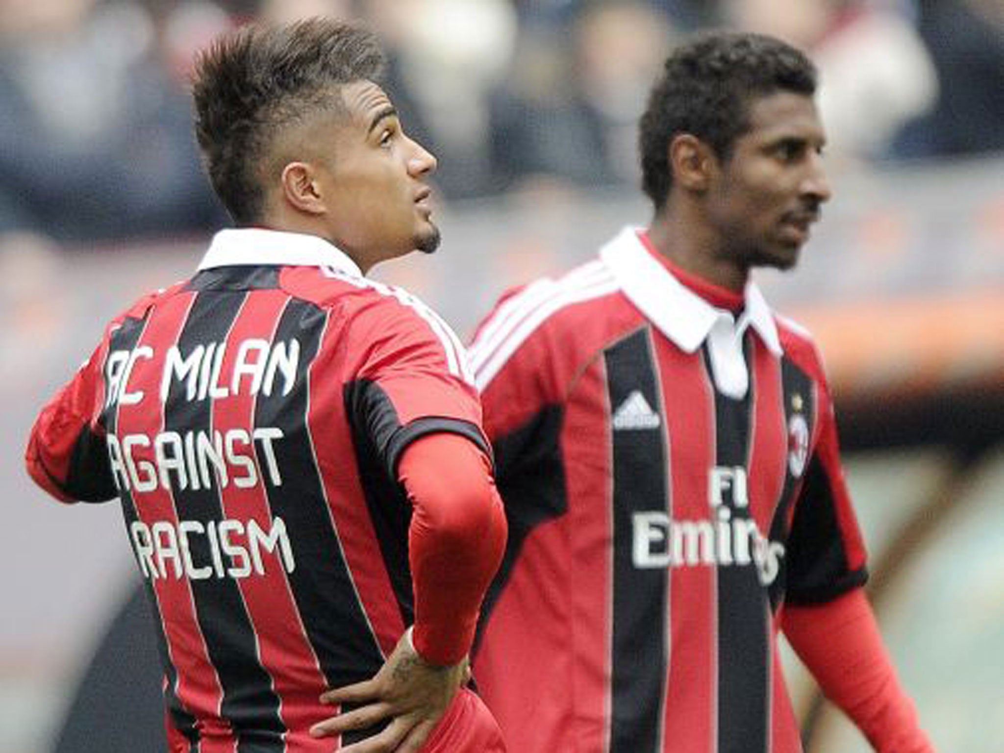 Milan’s Kevin-Prince Boateng (left) and Kevin Constant wear anti-racism shirts before their game against Siena yesterday