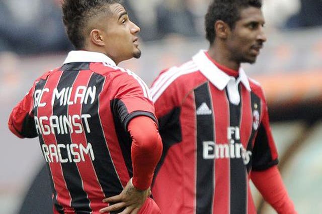 Milan’s Kevin-Prince Boateng (left) and Kevin Constant wear  anti-racism shirts before their game against Siena yesterday  