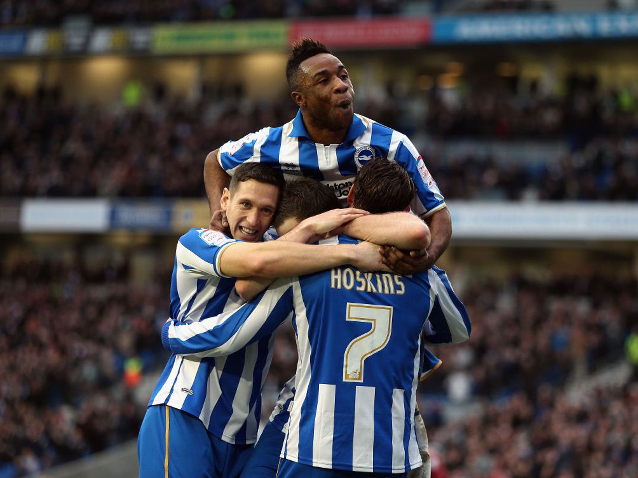 Will Hoskins is mobbed after scoring for Brighton on Saturday