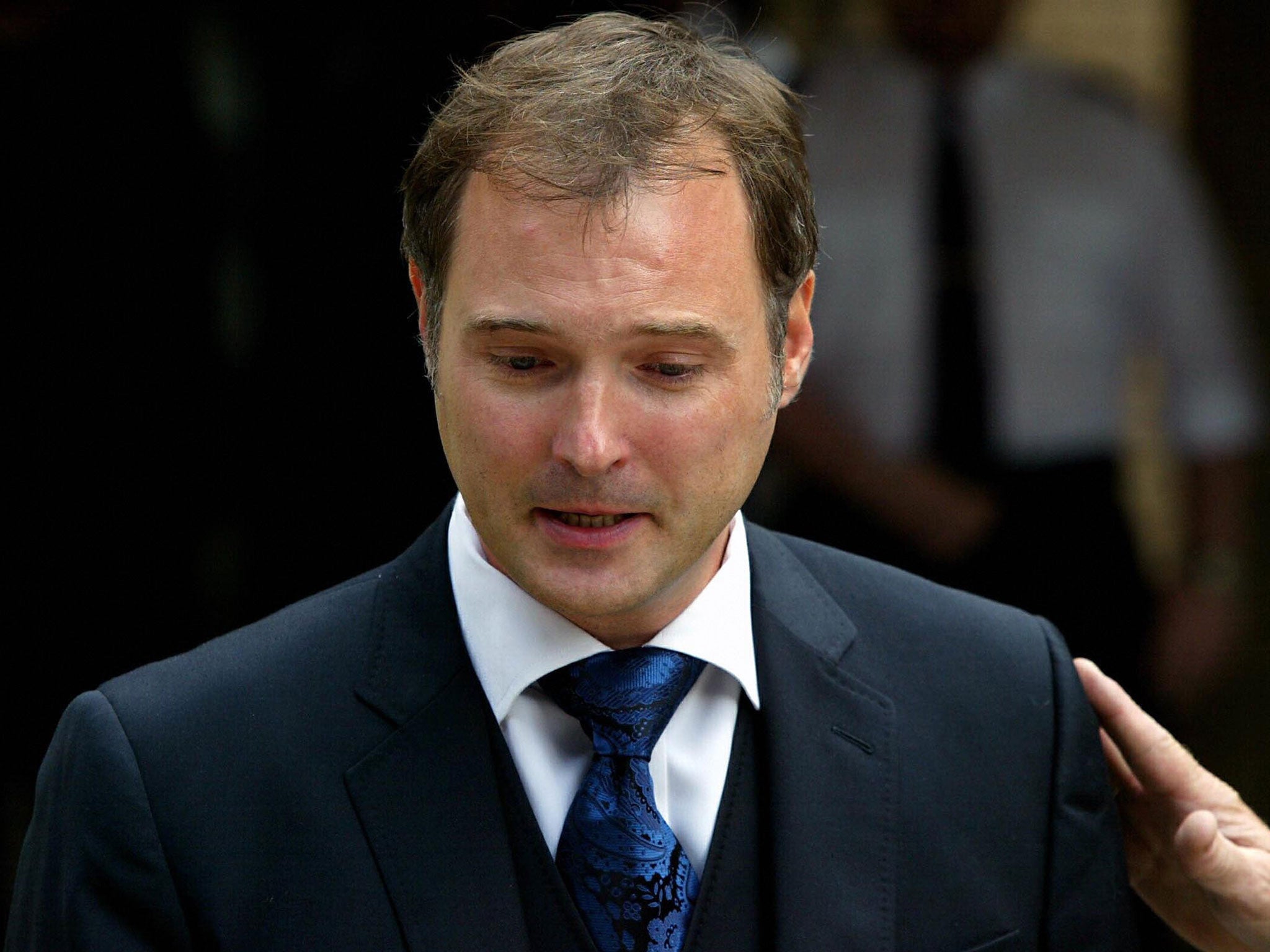 British ex-television presenter John Leslie in tears as he speaks to the media after he was cleared of all charges against him at Southwark crown court in London 31 July 2003.
