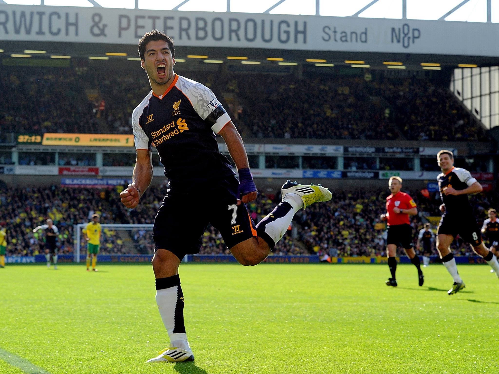 Suarez scores a stunning hat-trick as Liverpool thrash Norwich 5-2 at Carrow Road.
