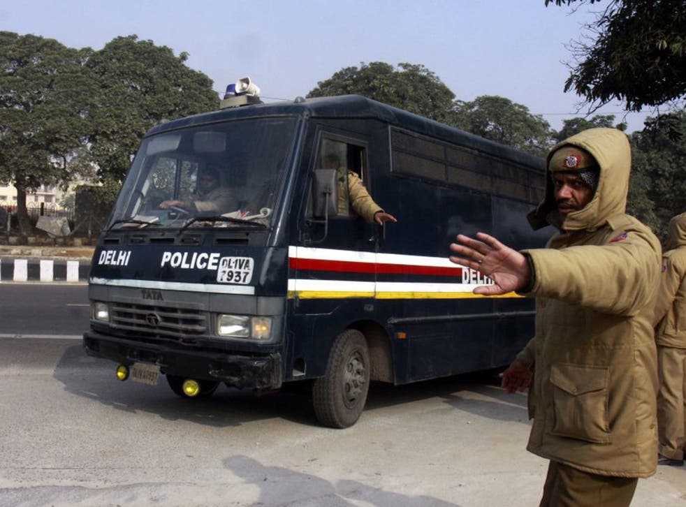 A van carrying the five men accused of the gang rape arrives at a Delhi court yesterday