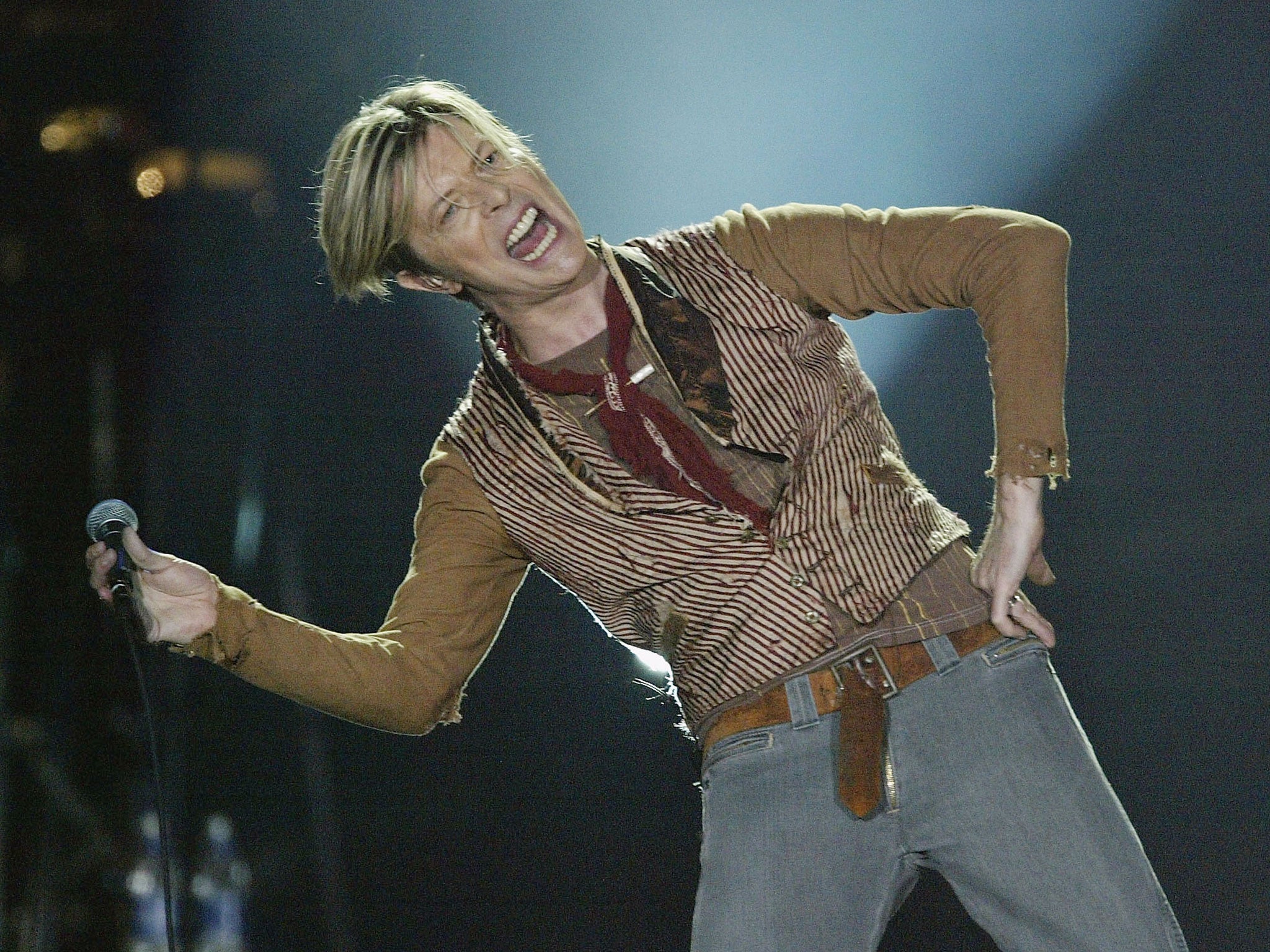 David Bowie performs on the first night of his UK tour at the MEN Arena on November 17, 2003 in Manchester, England.