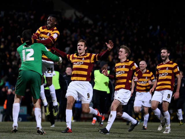 League Two Bradford celebrate victory over Arsenal