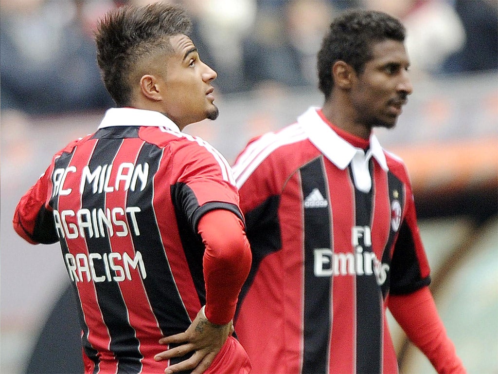 AC Milan’s Kevin-Prince Boateng, left, was racially abused