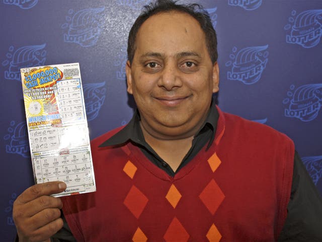 Urooj Khan poses with the winning lottery ticket