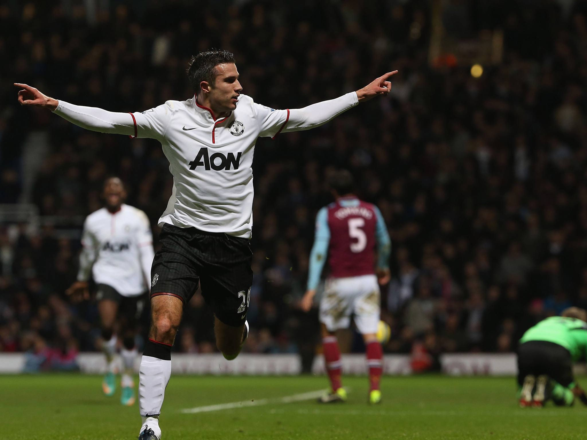 Robin van Persie celebrates his late equaliser against West Ham in the FA Cup