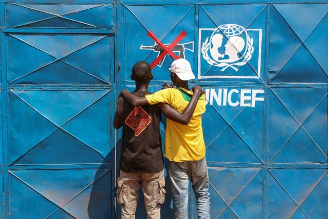 Two former child soldiers stand outside the Unicef Transit Centre in the town of Bria