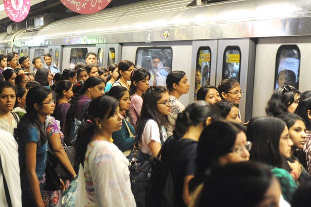 Passengers wait to board a ‘women only’ carriage