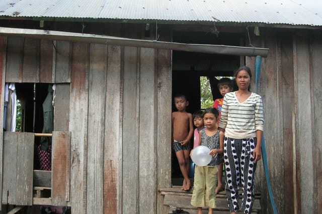 A single mother with her children at the project