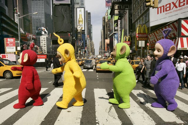 The world famous Teletubbies (L-R) Po, Laa-Laa, Dipsy and Tinky-Winky cross 7th Avenue in Times Square in New York 27 March 2007 as they arrive on American soil in person for the first time ever.