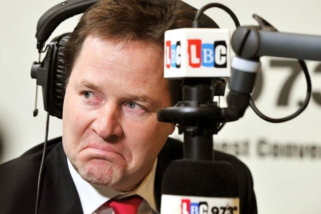 The Deputy Prime Minister Nick Clegg listens to a question from a listener during the LBC radio phone-in programme with host Nick Ferrari
