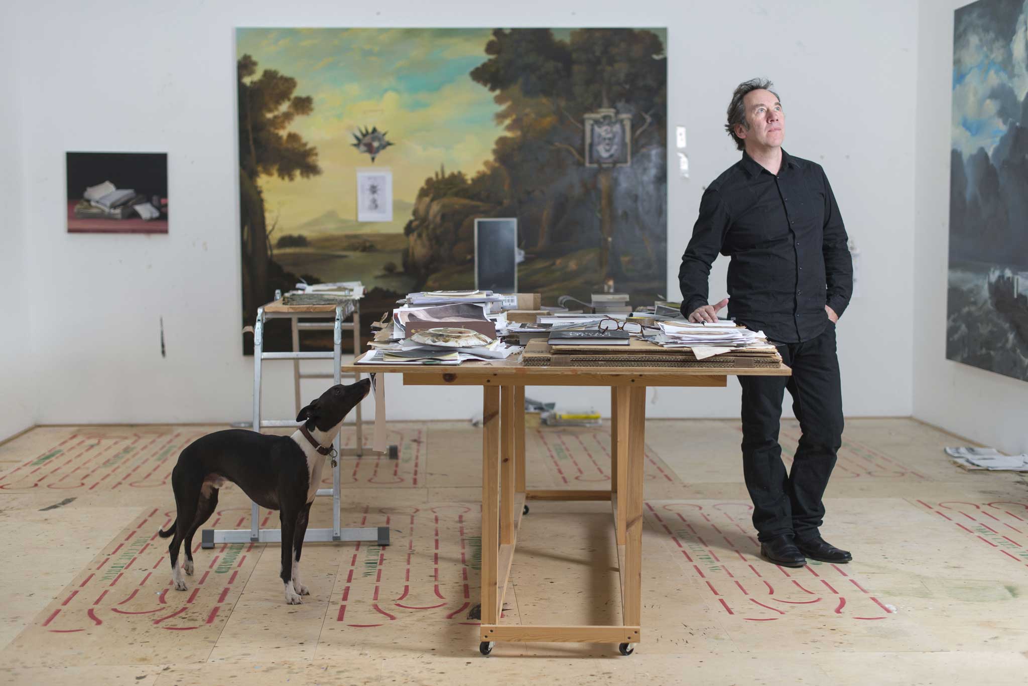 Paint it black: Ged Quinn with his dog Percy in the studio at his home near Madron, Cornwall