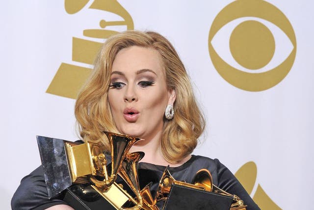 Eyes on the prize: Adele with her Grammys