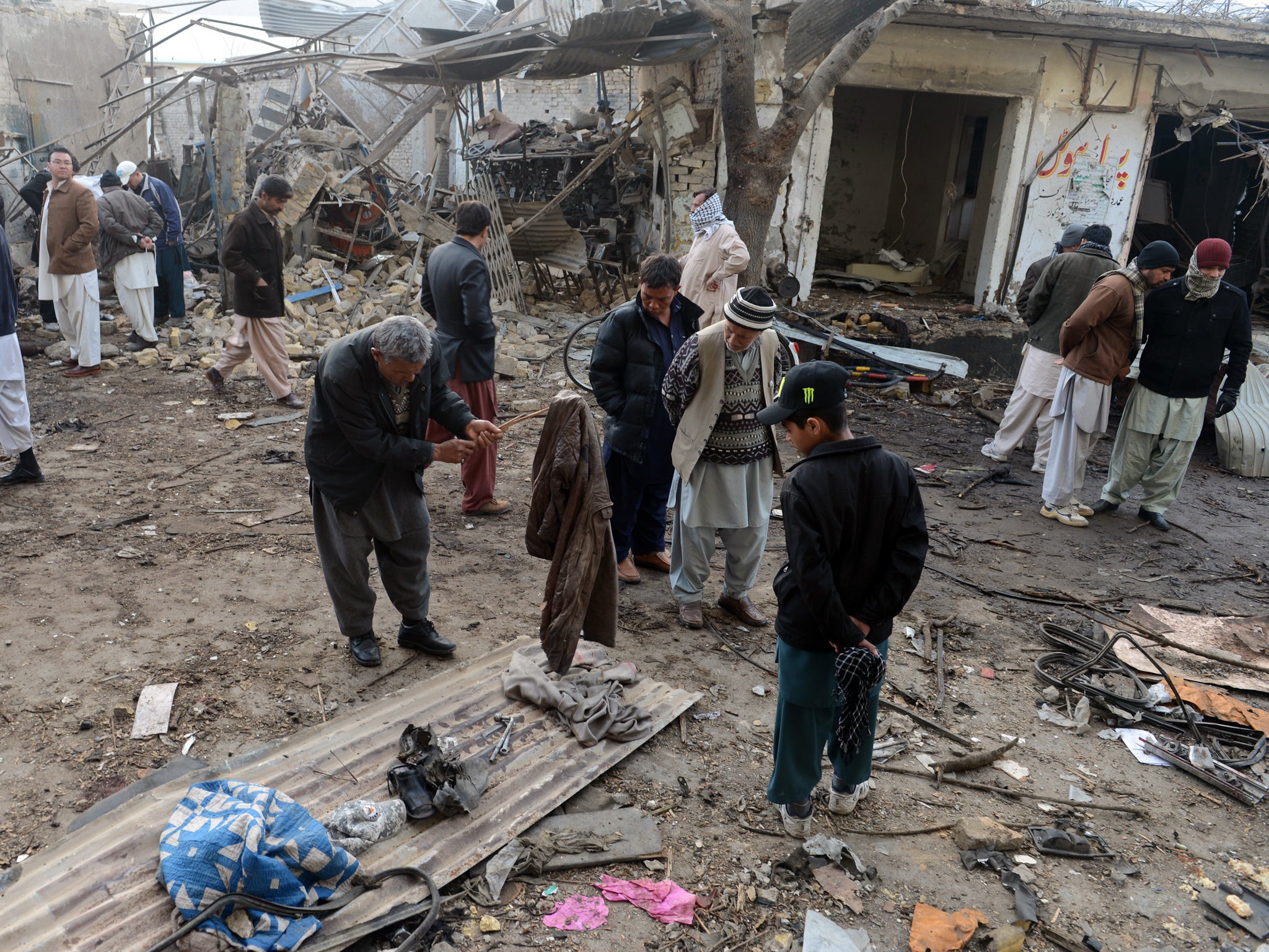 Residents gather at the site of bombings in Quetta