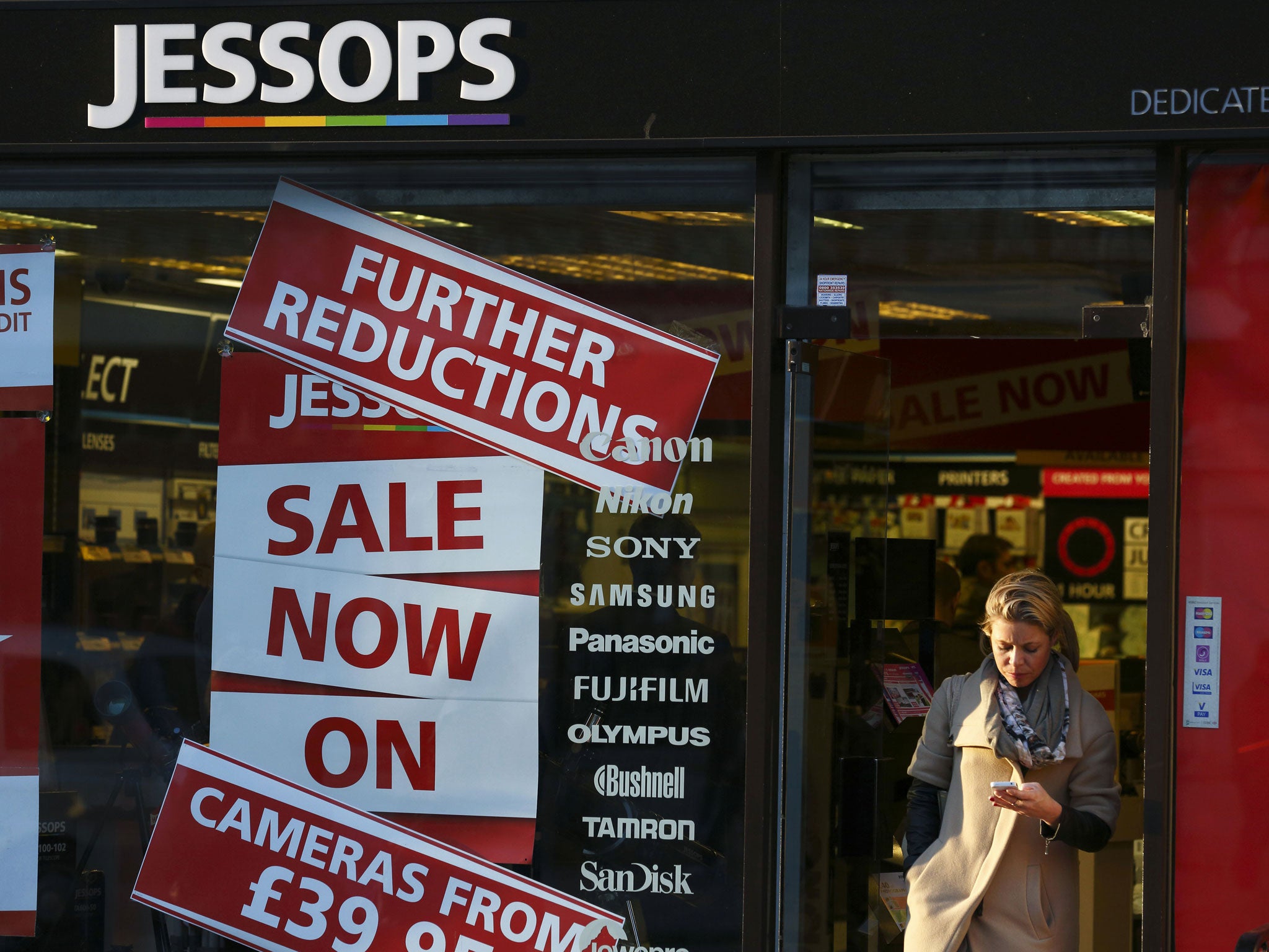 A woman leaves a branch of Jessops camera shop in Central London on January 9, 2013. British photographic chain Jessops went into adminstration on January 9, 2013, putting some 2,000 jobs at risk.