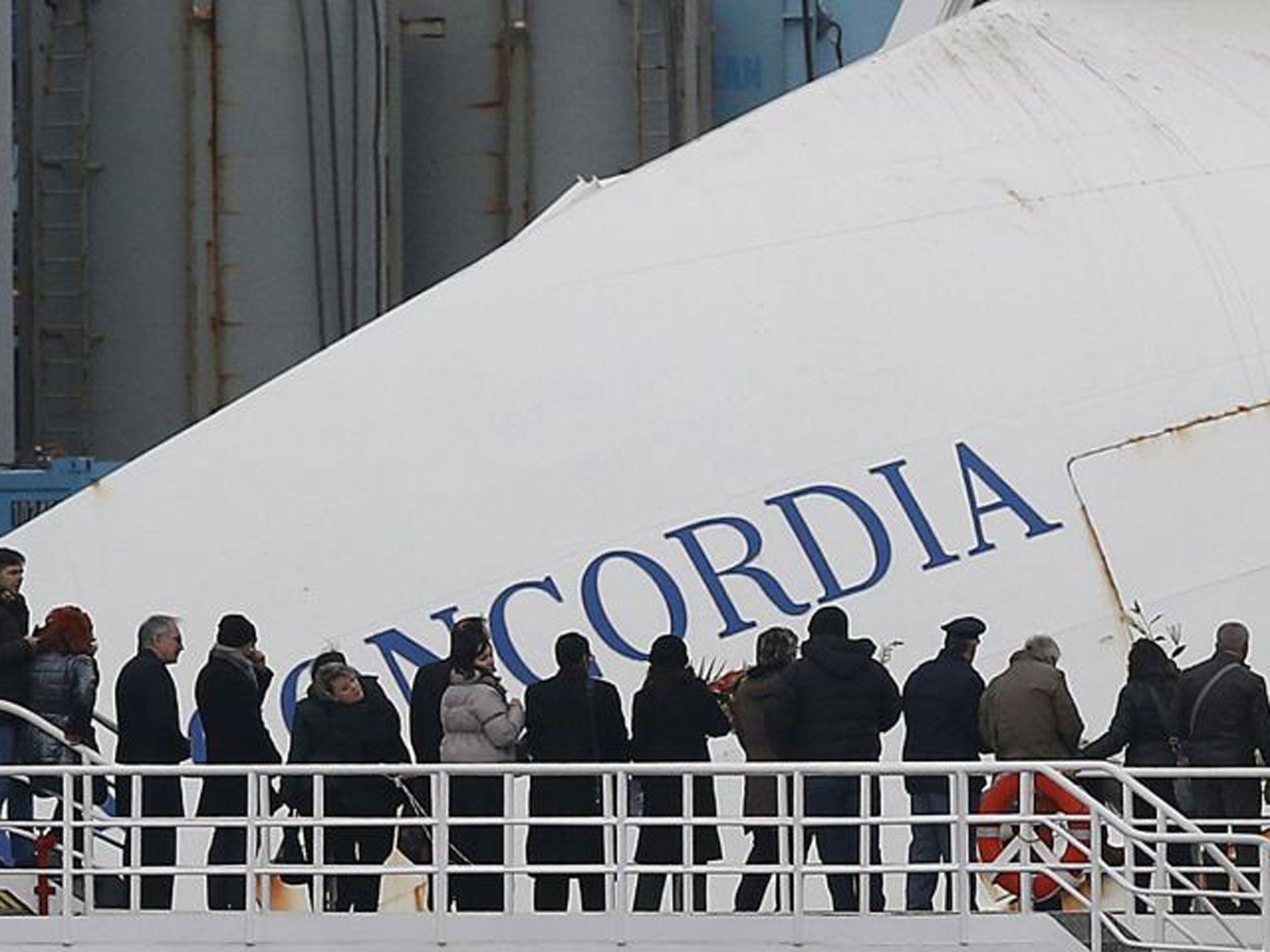 Survivors of the Costa Concordia shipwreck and relatives of the 32 people who died mark the first anniversary of its grounding