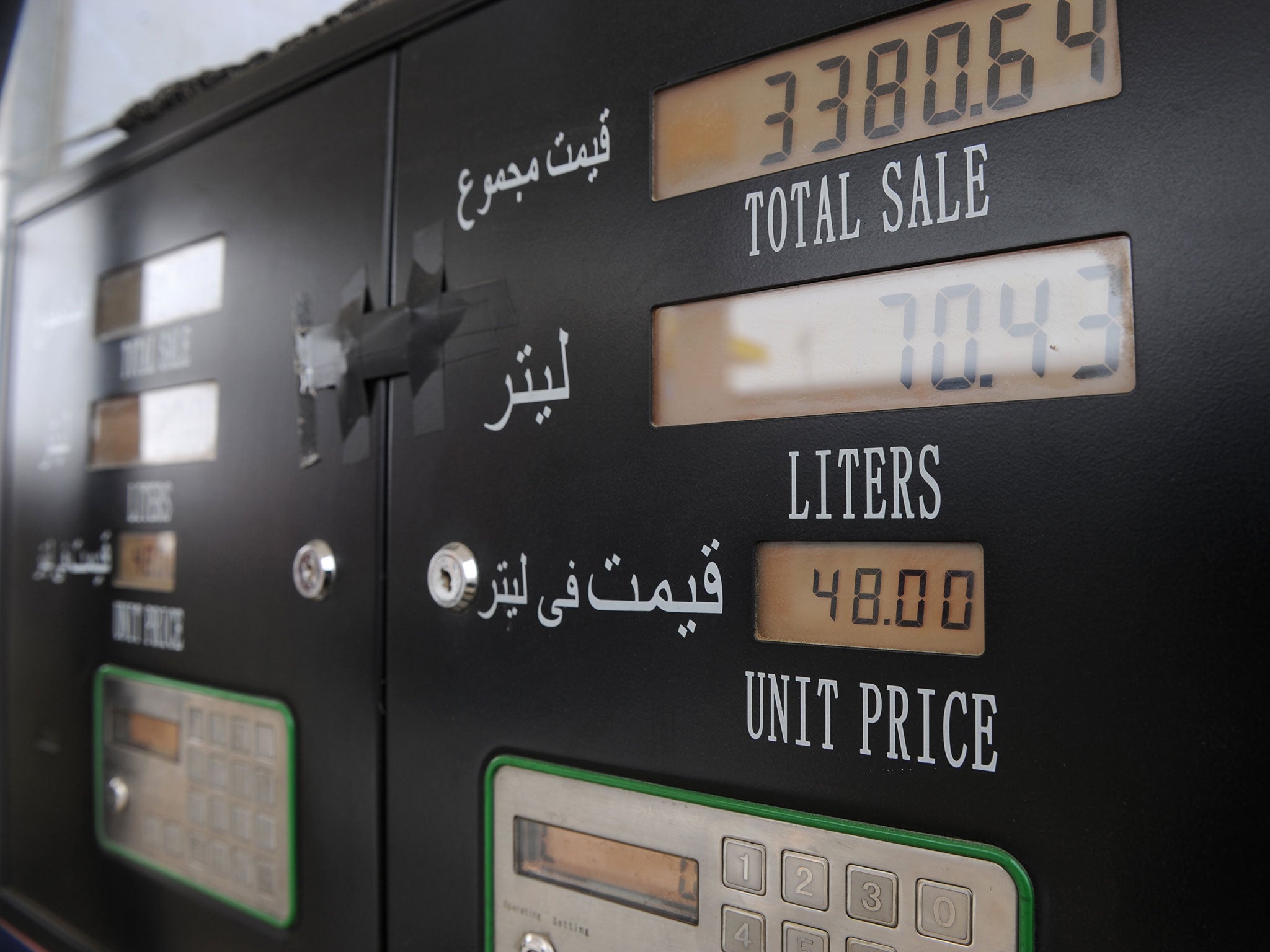 An automated pumping machine displays the rates of different types of gasoline at station in Shamali Plains, some 20 kms north of Kabul