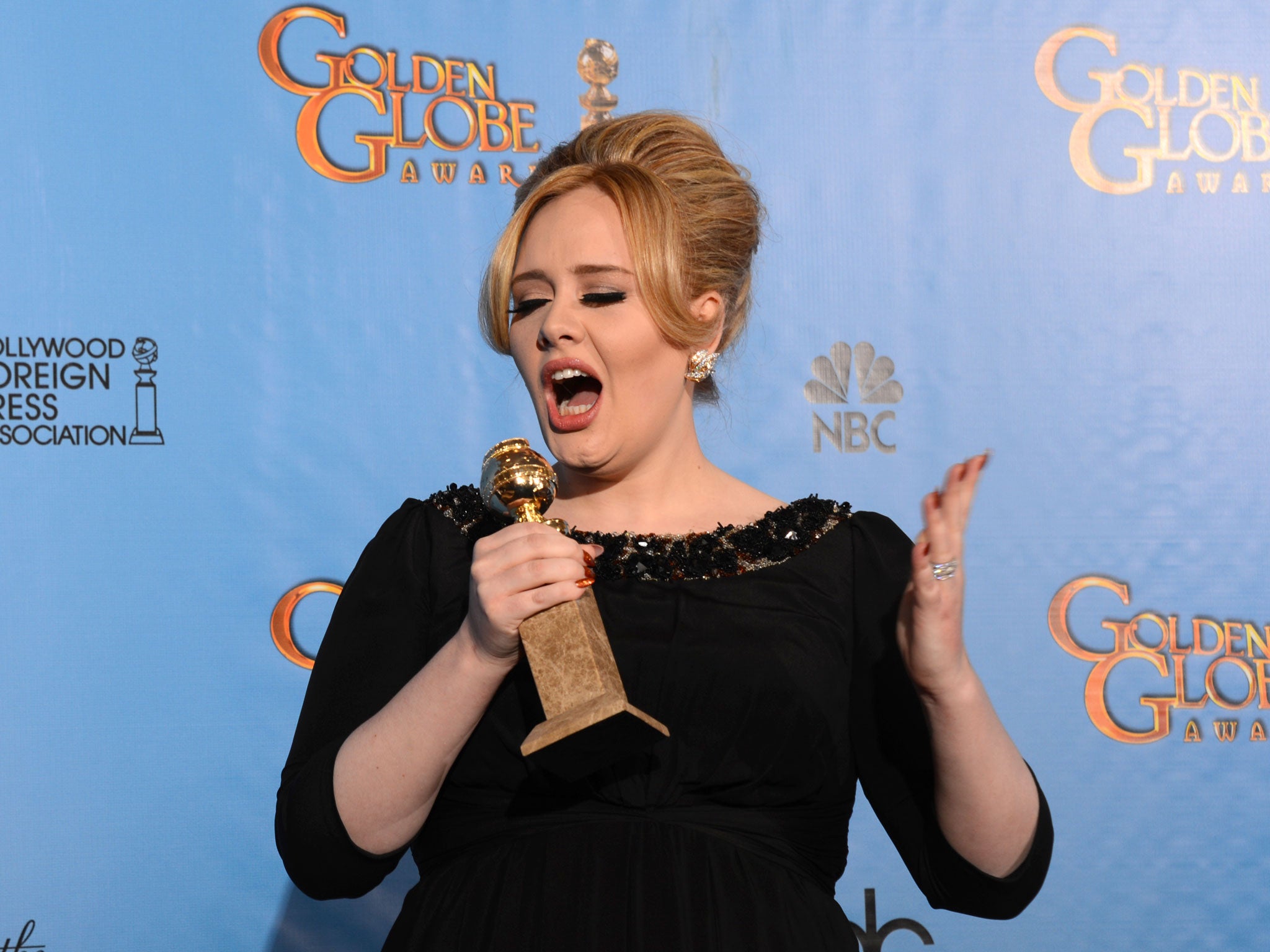 Singer Adele poses in the press room with her best original song in a motion picture award for 'Skyfall' at the Golden Globes awards ceremony in Beverly Hills on January 13, 2013.