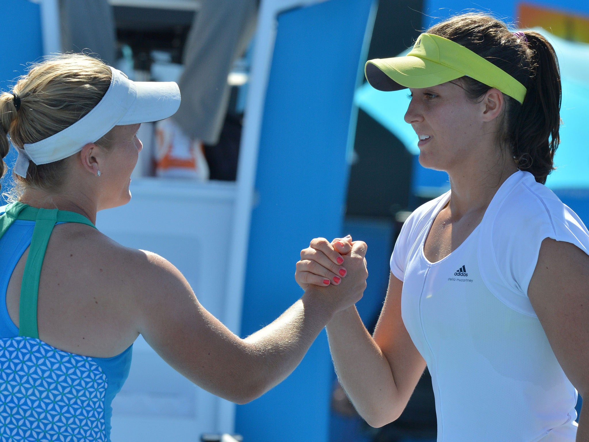 Laura Robson (right) shakes hands with Melanie Oudin of the US after her victory
