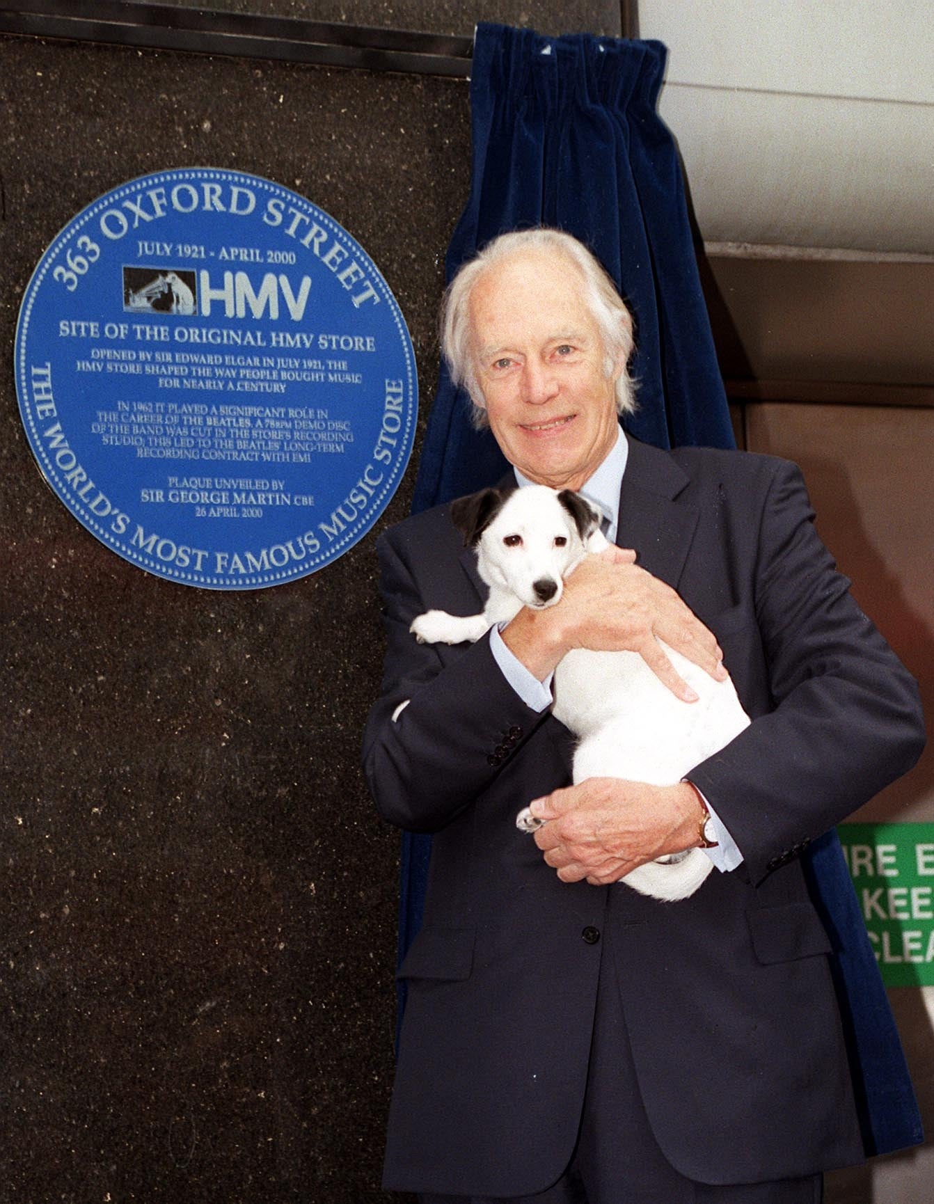 Beatles producer Sir George Martin with Nipper the dog, at the unveiling of a plaque, in London's Oxford Street, to record the role the record store played in bringing the Beatles to fame in 2000