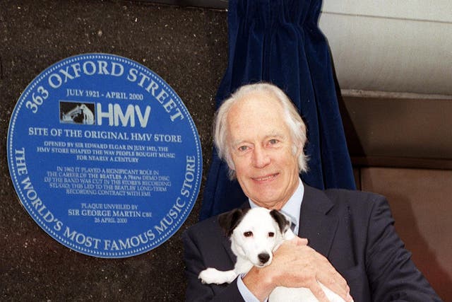 Beatles producer Sir George Martin with Nipper the dog, at the unveiling of a plaque, in London's Oxford Street, to record the role the record store played in bringing the Beatles to fame in 2000
