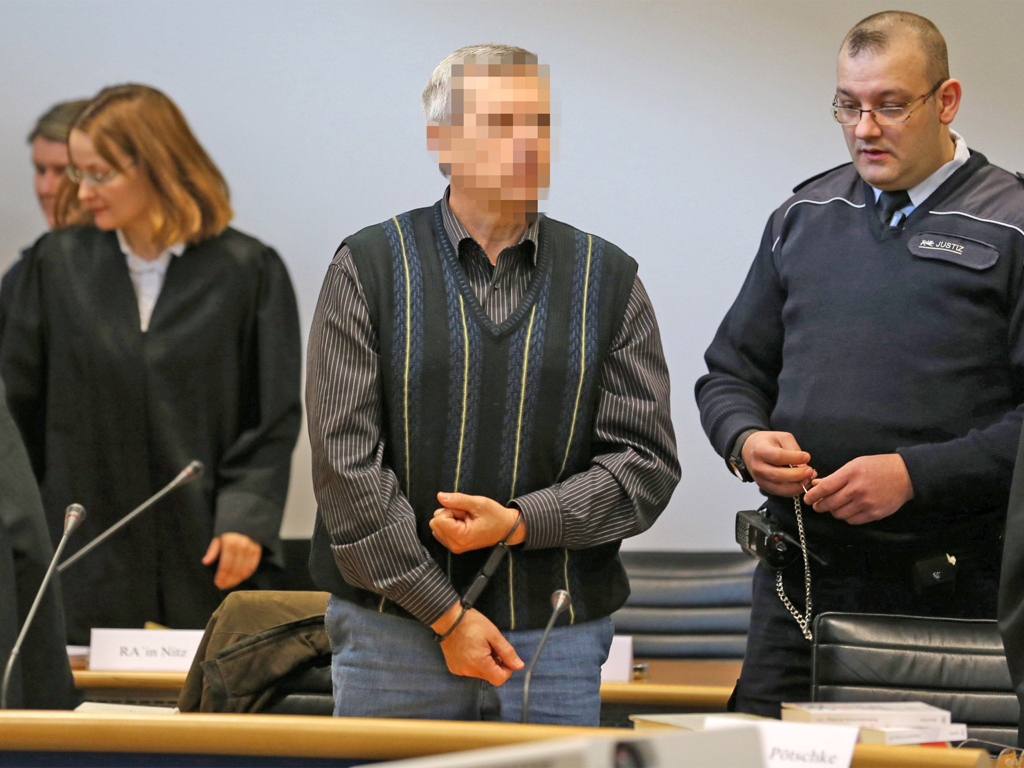 Accused Russian spy with the alias Andreas Anschlag appears in court on the first day of his trial