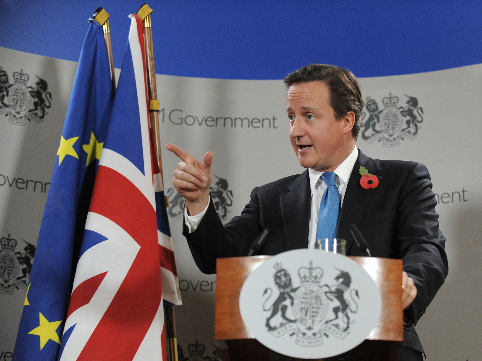 British Prime Minister David Cameron speaks during a press conference on the second day of a European Union summit on October 29, 2010 at the European Council headquarters in Brussels.