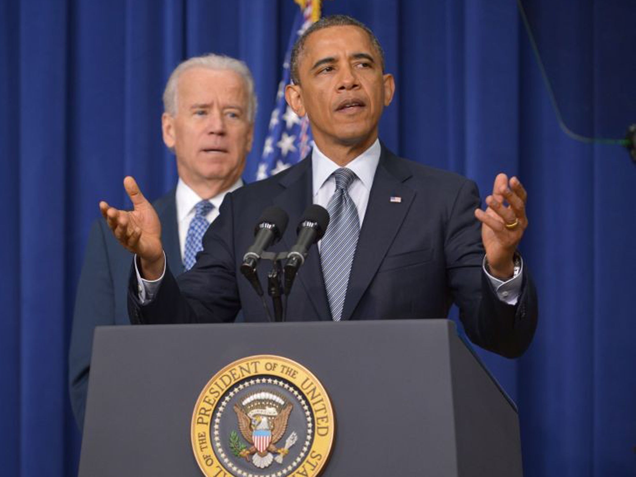 President Obama speaks at the White House, watched on by Vice President Joe Biden