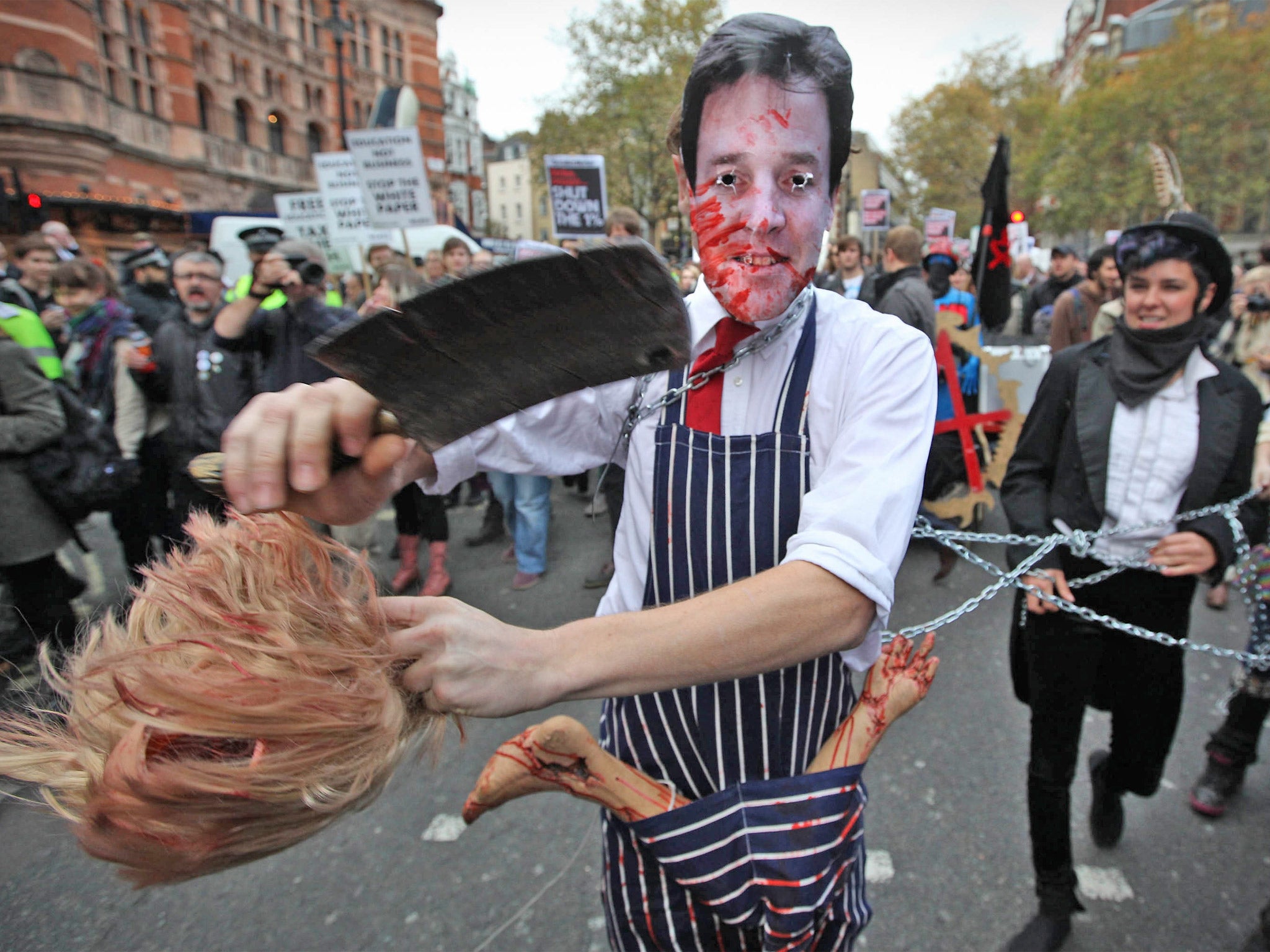 A student in a Nick Clegg mask protests against higher tuition fees in London in 2011