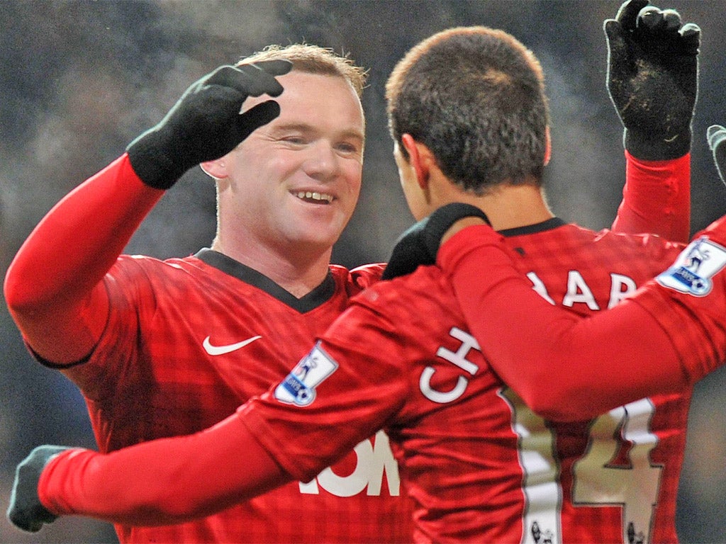 Wayne Rooney is congratulated after putting Manchester United ahead