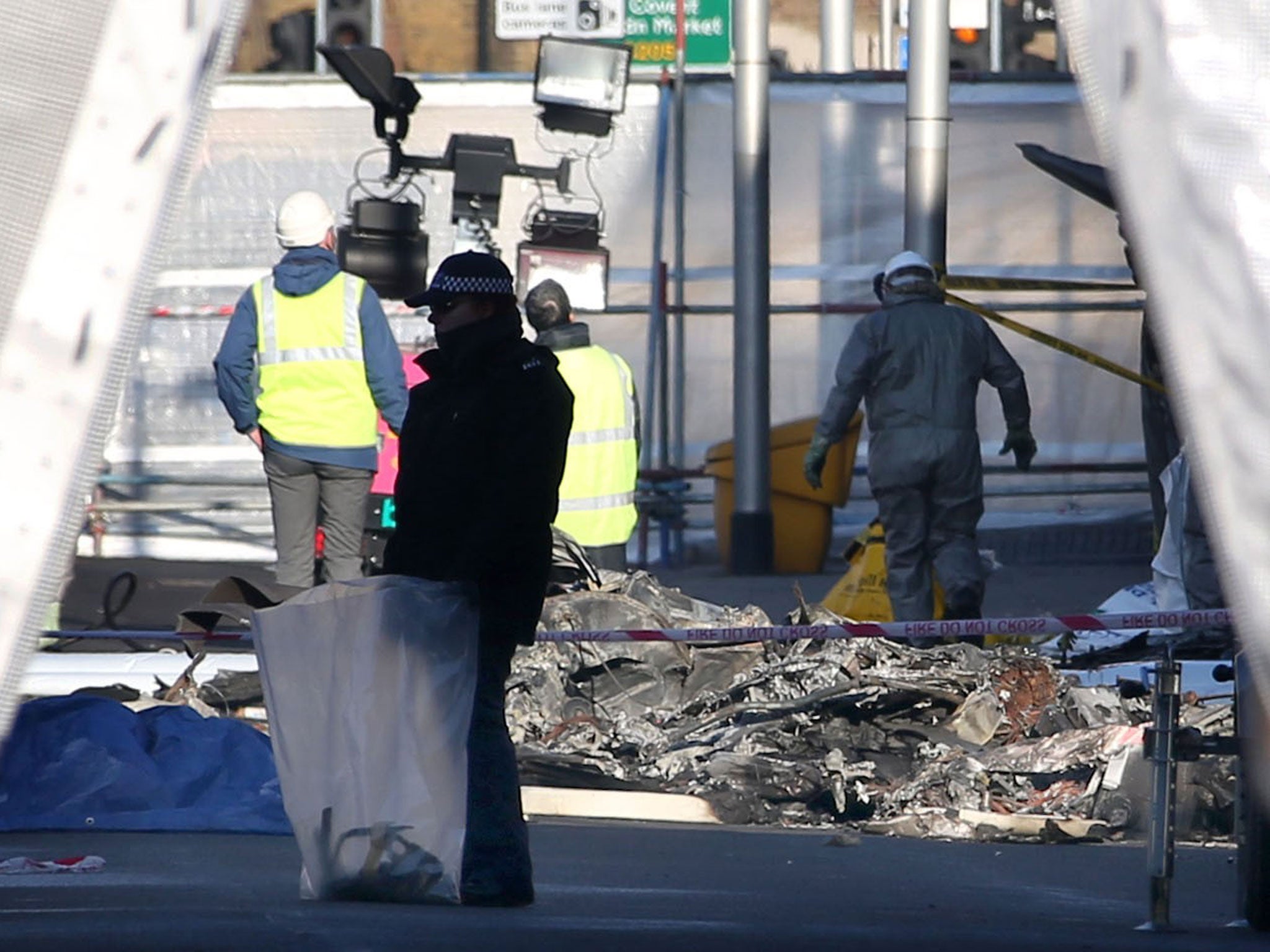 Investigators at the crash scene in Vauxhall yesterday