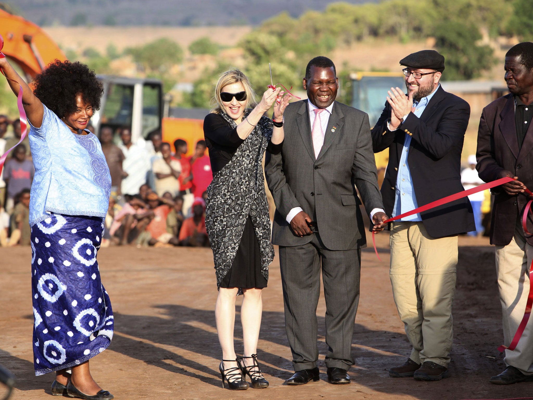 Pop star Madonna cuts the ribbon at the ground breaking ceremony for the Raising Malawi Academy for Girls in Malawi in 2009