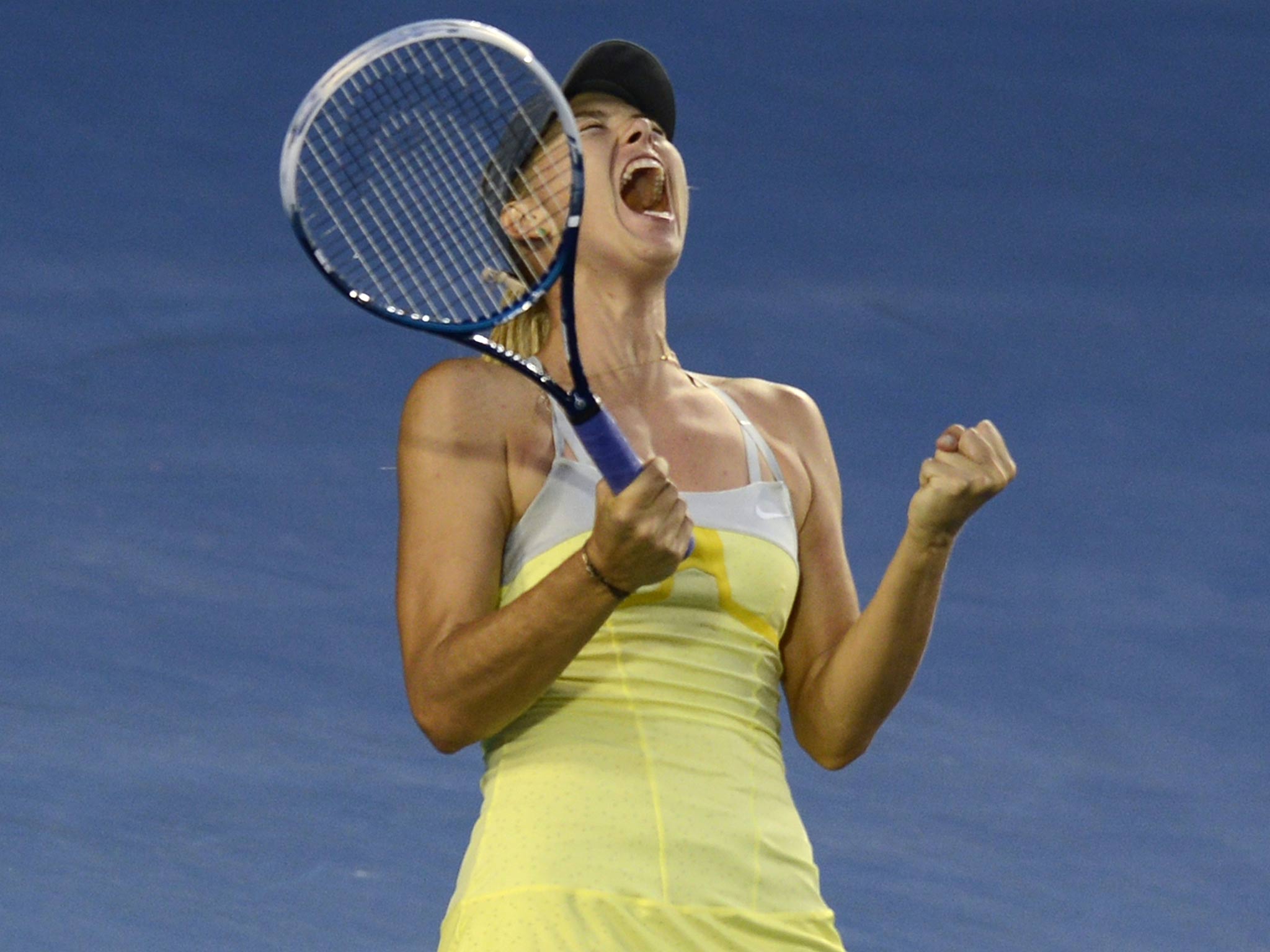 Maria Sharapova celebrates victory over Venus Williams