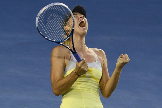 Maria Sharapova celebrates victory over Venus Williams