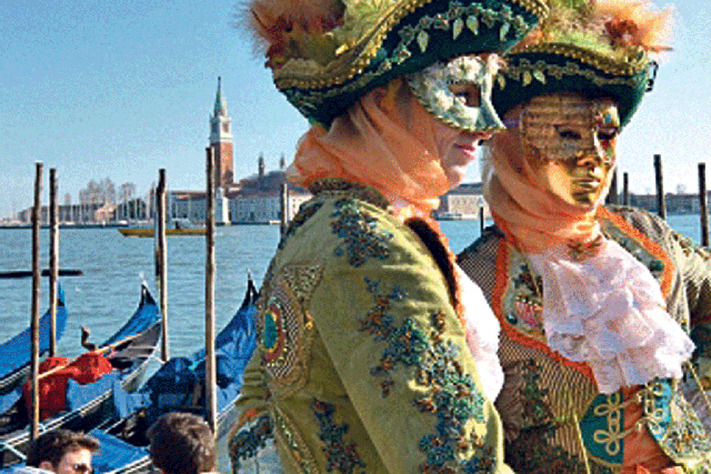 Feathered friends: Venice carnival-goers