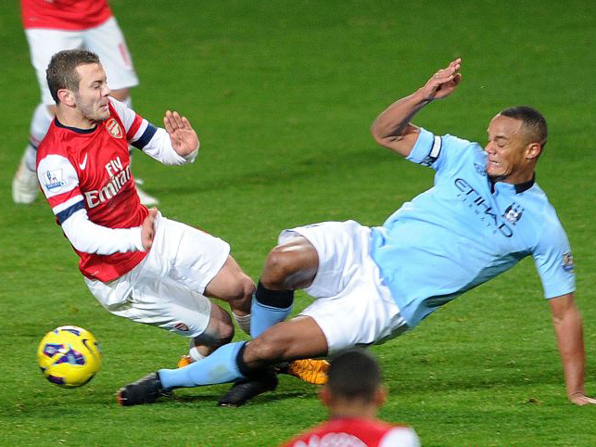 Vincent Kompany (right) has been told to tackle more carefully