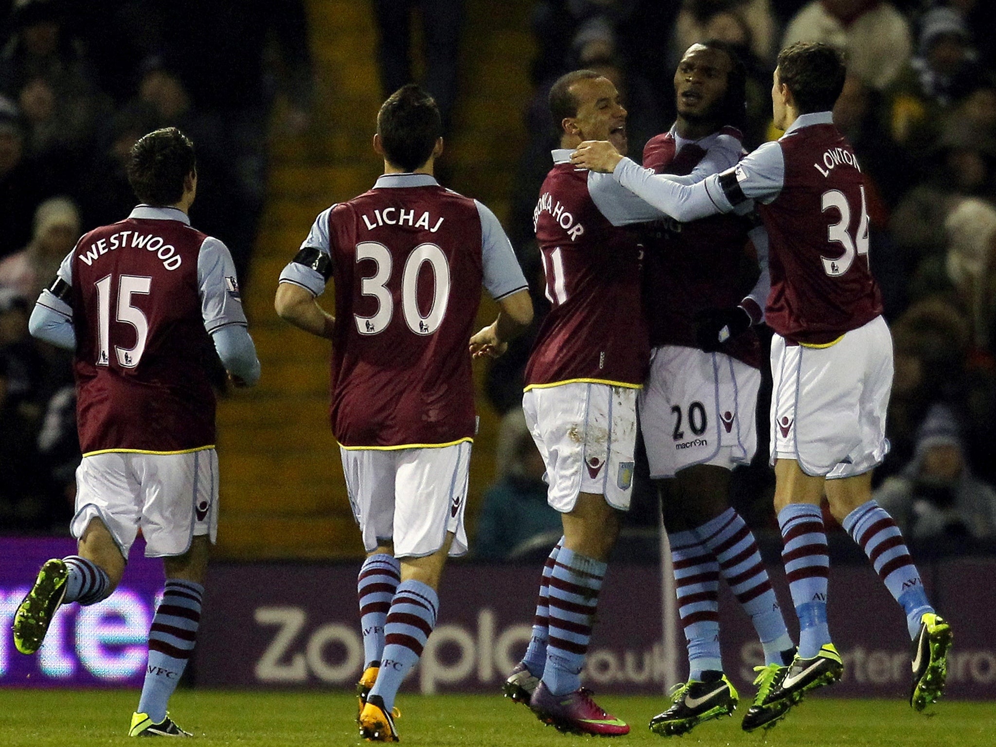 Christian Benteke celebrates with his teammates after his opening goal