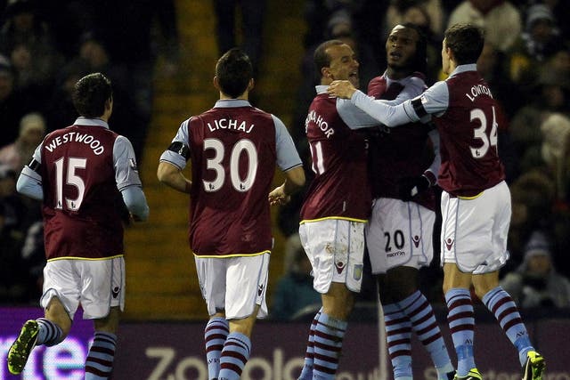 Christian Benteke celebrates with his teammates after his opening goal